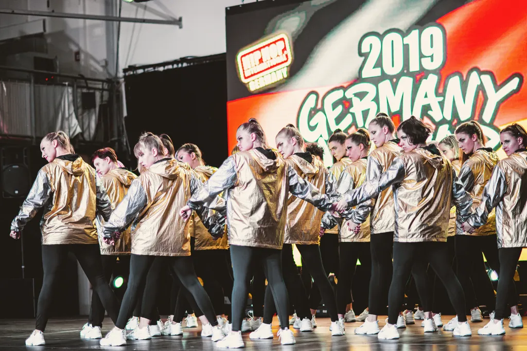 Large crew in gold jackets at the Germany Hip Hop Dance Championship 2019