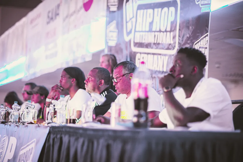 The judges at the scoring table at HHI Germany, focused on the stage