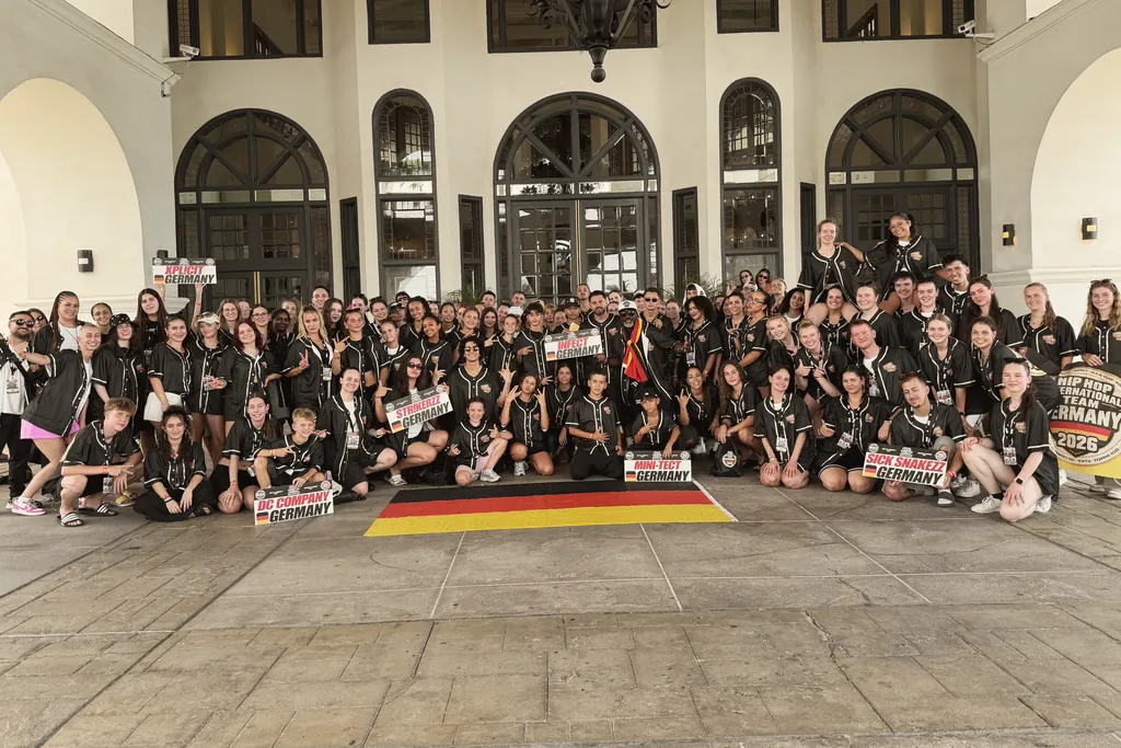 Group photo of the German hip hop national team 2026 with all crews, their signs and the German flag