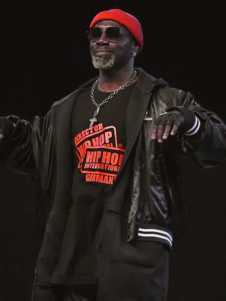 Olando, National Director of HHI Germany, on stage in his Hip Hop International Germany director shirt