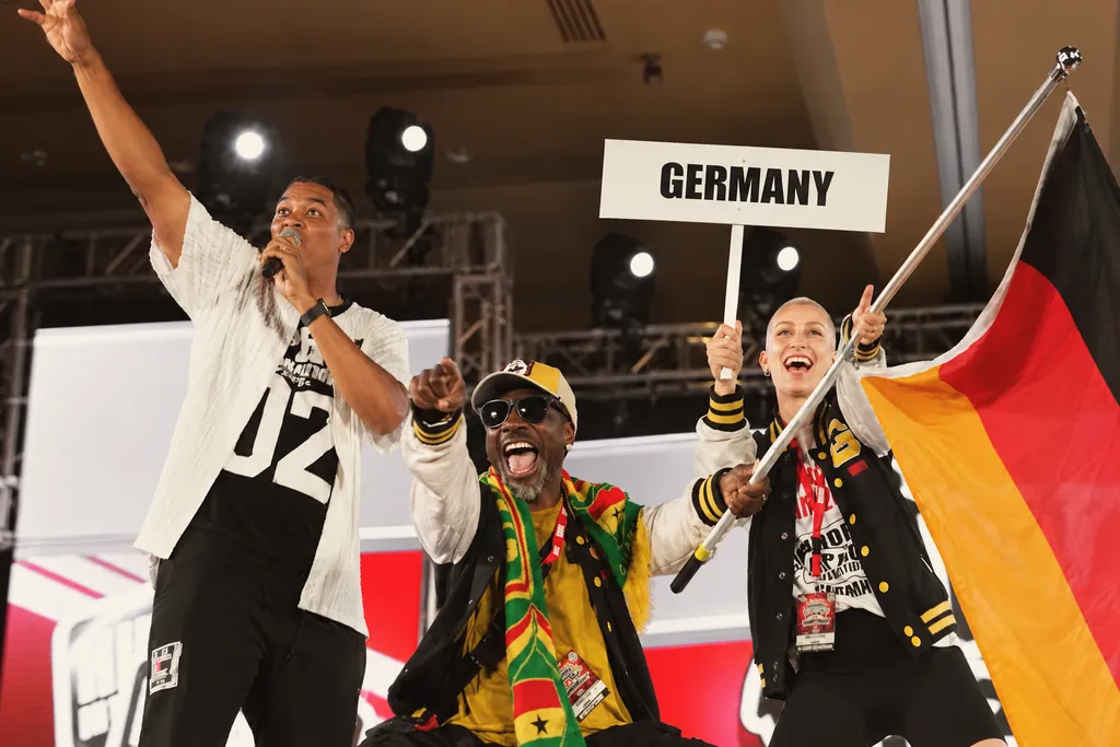 Team Germany in the parade of nations at the World Hip Hop Dance Championships with the German flag and a Germany sign, Olando in the middle